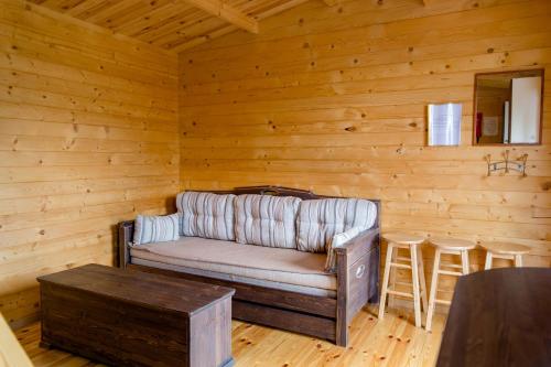 a living room with a couch and a table at Ermistu Puhkeküla in Ermistu