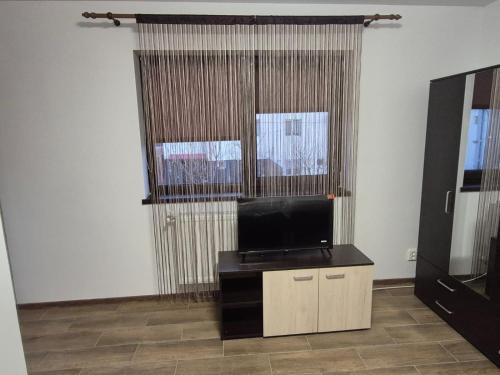 a living room with a flat screen tv in a room at BVA&Studio 
