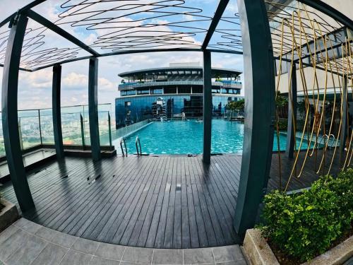 a large swimming pool in a building at TM Persiaran Stonor BY PANORAMA in Kuala Lumpur