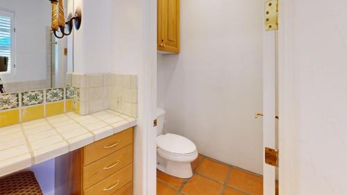 a bathroom with a toilet and a sink at SV253 2BR 3BA Spa Villa with Pool Access & Views in La Quinta