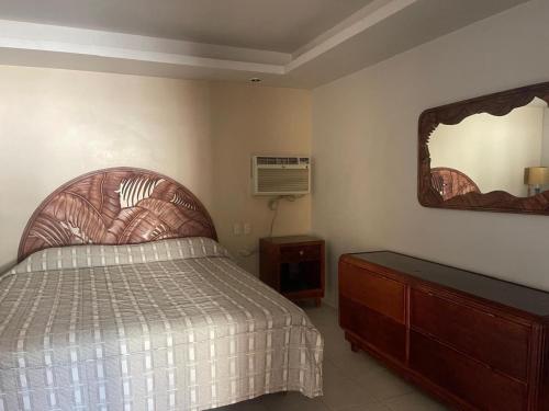 Postel nebo postele na pokoji v ubytování Hotel Colonial
