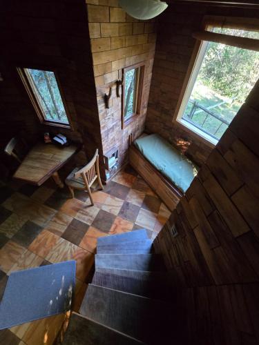 an overhead view of a living room with a couch and stairs at Aremko Aguas Calientes & Spa in Puerto Varas