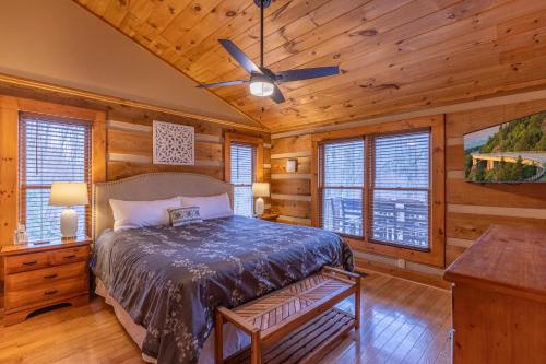 a bedroom with a bed and a ceiling fan at Lakeview in Vilas