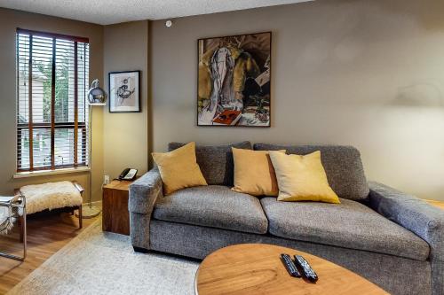 a living room with a couch and a table at The Marquise 321 in Whistler