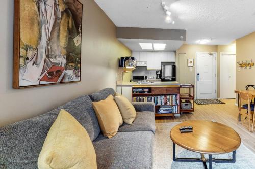 a living room with a couch and a table at The Marquise 321 in Whistler