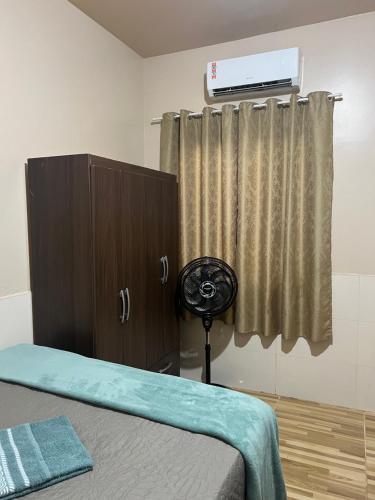 En eller flere senge i et værelse på Residencial Meurer