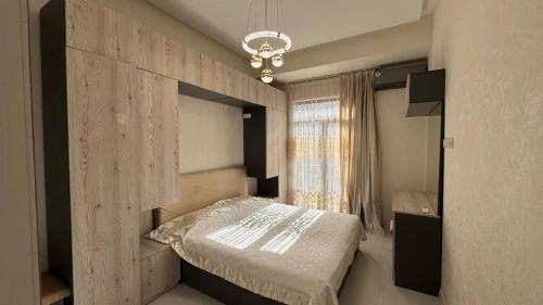 Postel nebo postele na pokoji v ubytování Boulevard Tashkent City