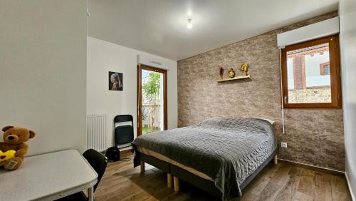 Ένα ή περισσότερα κρεβάτια σε δωμάτιο στο Le Terriers