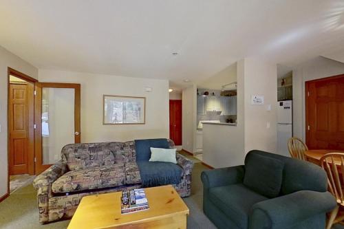 a living room with a couch and a table at The Lagoons 27 in Whistler