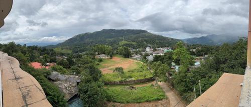 an aerial view of a small town in the mountains at View 240 in Rikillagaskada