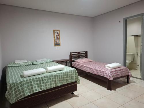 Postel nebo postele na pokoji v ubytování Quarto no centro de Araguaína com garagem