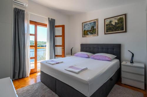 Katil atau katil-katil dalam bilik di Holiday Home Jelena