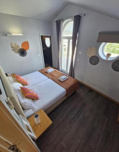 a bedroom with a large bed and a window at Blue Orange Porto Apart in Porto