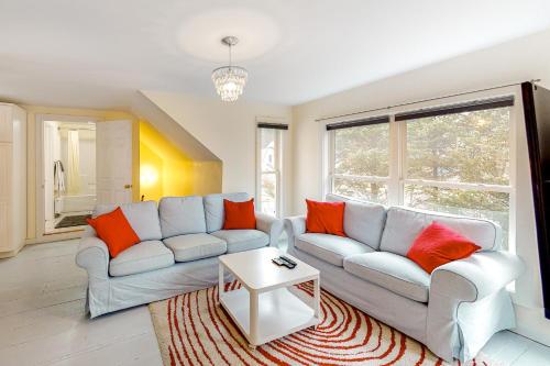 a living room with two couches and a table at Seatoller Unit C in Ludlow