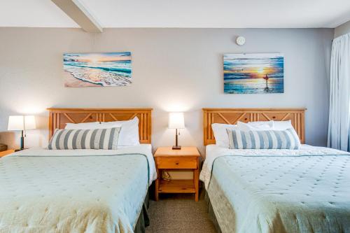 two beds sitting next to each other in a bedroom at Chula Vista Resort Villa # 7111 in Wisconsin Dells