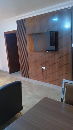 a room with a brick wall with a table and a wall at Royale Signature in Lagos