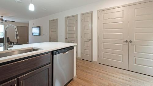 a kitchen with a sink and a dishwasher at Landing at Cove at Pine Ridge - 1 Bedroom in Lyman in Lyman