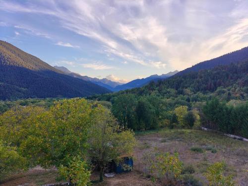 a view of a valley with mountains and trees at Chimpanzee Forest House in Karpenision