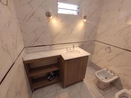a bathroom with a sink and a toilet at Casa Tafí in Tafí Viejo