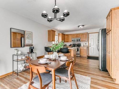 a kitchen and dining room with a table and chairs at 4901 Waller in Ames