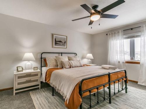 a bedroom with a bed and a ceiling fan at 4901 Waller in Ames