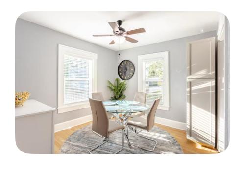 a dining room with a table and chairs at Gated single family home downtown ST Petersburg, FL in St. Petersburg
