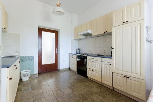 Kuchyň nebo kuchyňský kout v ubytování Apartments Sime