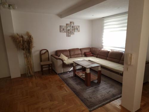 a living room with a couch and a table at Anes' apartment in Mostar