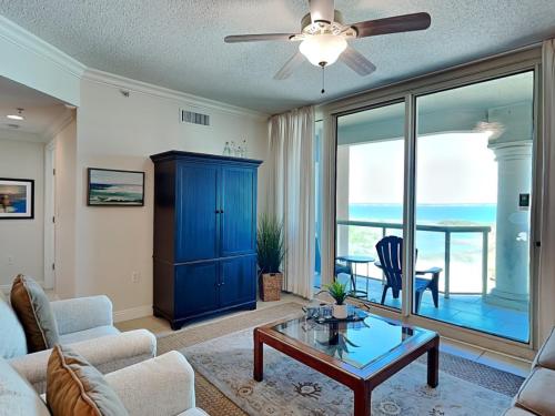 a living room with a couch and a table at Portofino Island Resort #2-1002 in Pensacola Beach