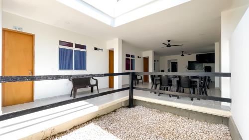 a room with a balcony with a table and chairs at Habitación Manglares 102 in Coveñas