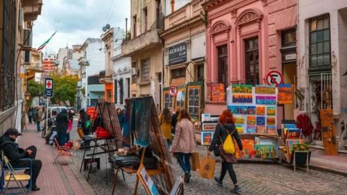 a group of people walking down a city street at Alojamiento en San Telmo in Buenos Aires