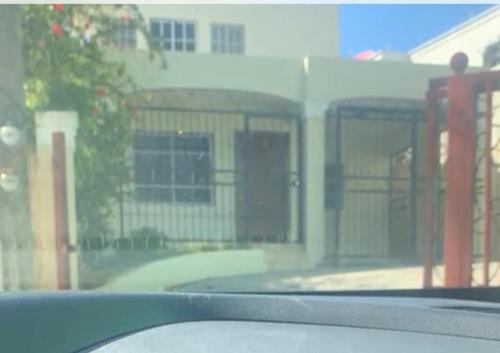 a view of a building from the inside of a car at Espacioso Casa en Puerto Plata cerca de La Playa 4 camas 3 baños Agua caliente Aire condicionado Wi-Fi in Puerto Plata