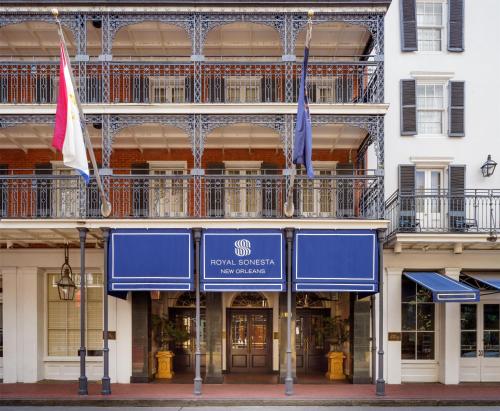 a building with two flags in front of it at The Royal Sonesta New Orleans in New Orleans
