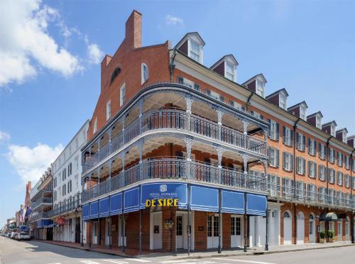 a large brick building on a city street at The Royal Sonesta New Orleans in New Orleans