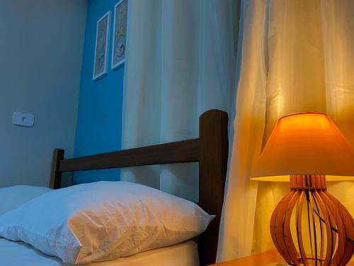 Postel nebo postele na pokoji v ubytování Aloha Oe Itaguá