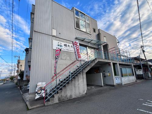 a building with a staircase on the side of it at 晴の松 in Wakayama