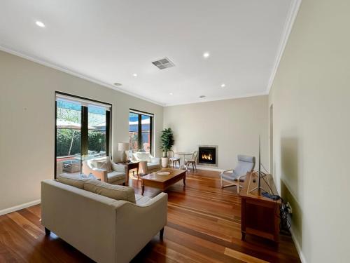 a living room with a couch and a table at Classic Meets Modern in Central Wagga in Wagga Wagga