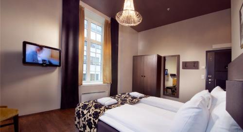 Postel nebo postele na pokoji v ubytování Banken Hotel