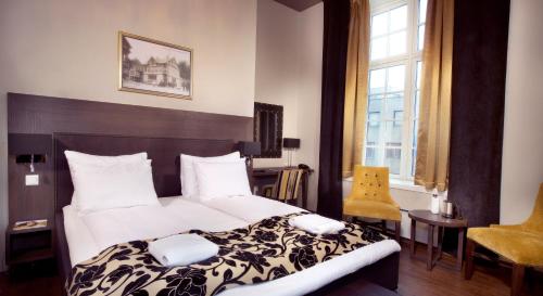 Postel nebo postele na pokoji v ubytování Banken Hotel