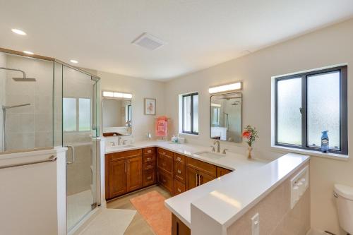 a bathroom with two sinks and a shower and a toilet at Punta Gorda Vacation Rental with Heated Pool and Lanai in Punta Gorda