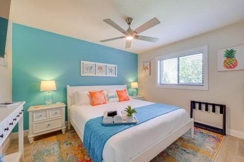 a bedroom with a bed and a ceiling fan at Punta Gorda Vacation Rental with Heated Pool and Lanai in Punta Gorda