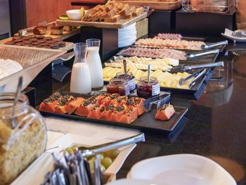 a buffet with many different types of food on display at ibis Sao Paulo Tatuape in Sao Paulo