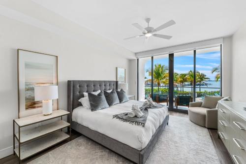 a bedroom with a large bed with a view of the ocean at Harbor Island Beach Club 205 in Melbourne Beach