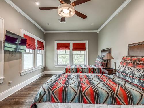 a bedroom with a bed and a ceiling fan at Stylish 3-Bedroom Home in Tulsa in Tulsa