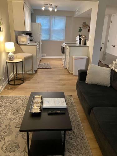 a living room with a couch and a coffee table at Davenport Dwellings Midtown Convenience in Omaha