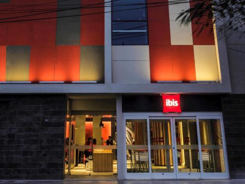 a building with a ups sign in front of it at ibis Trujillo in Trujillo