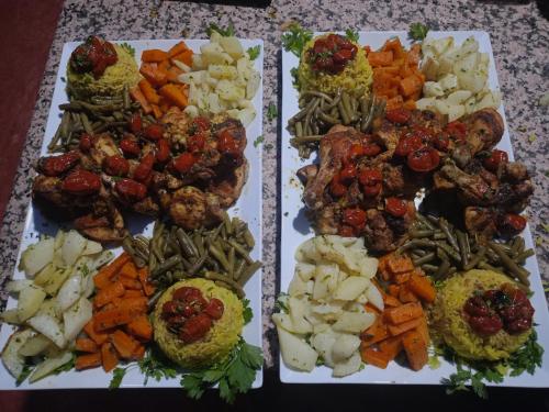 three plates of food with different types of vegetables at Siman luxury camp in Merzouga