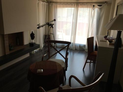 a room with a camera and a desk and a table at Hotel Calabria in La Garriga
