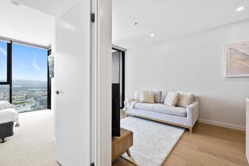 a living room with a couch and a window at Modern 1 Bedroom Unit at The Casino - NO PARKING - Q Stay in Gold Coast