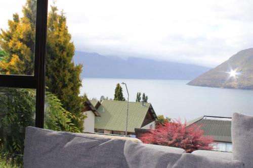 a view of a lake from a window at The Cameron Bothy in Queenstown